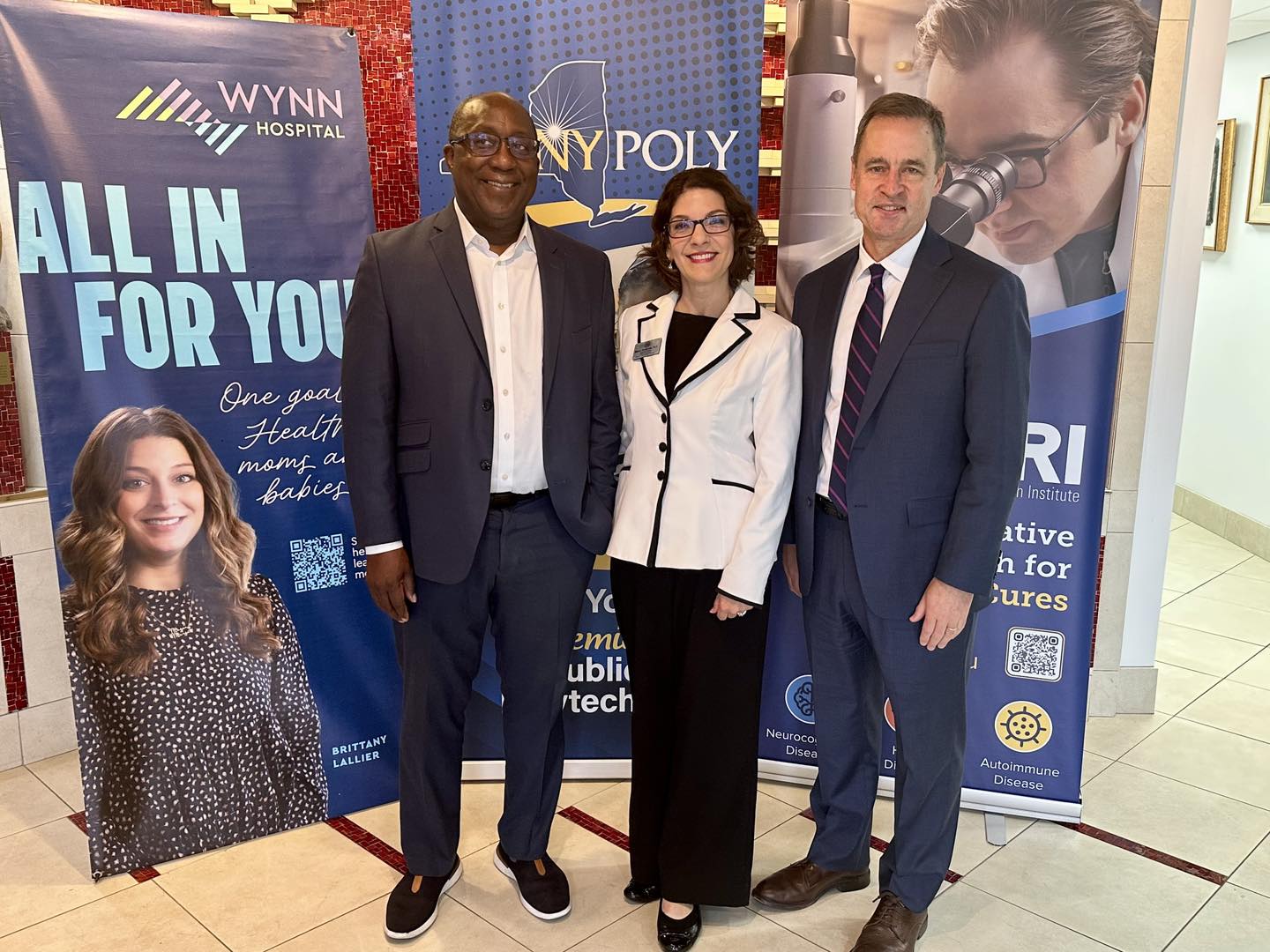 SUNY Poly representatives standing with healthcare partners