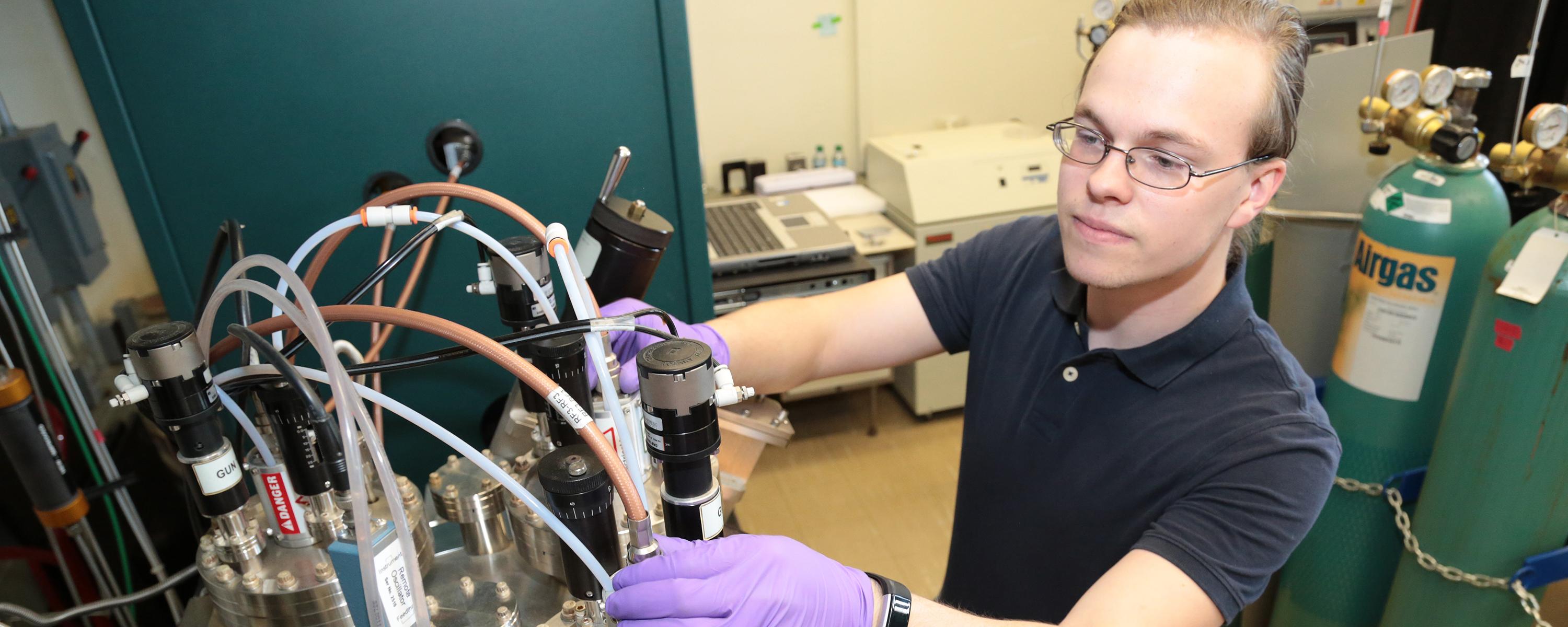 SUNY Poly student works in Dr. Harry Efstathiadis' lab