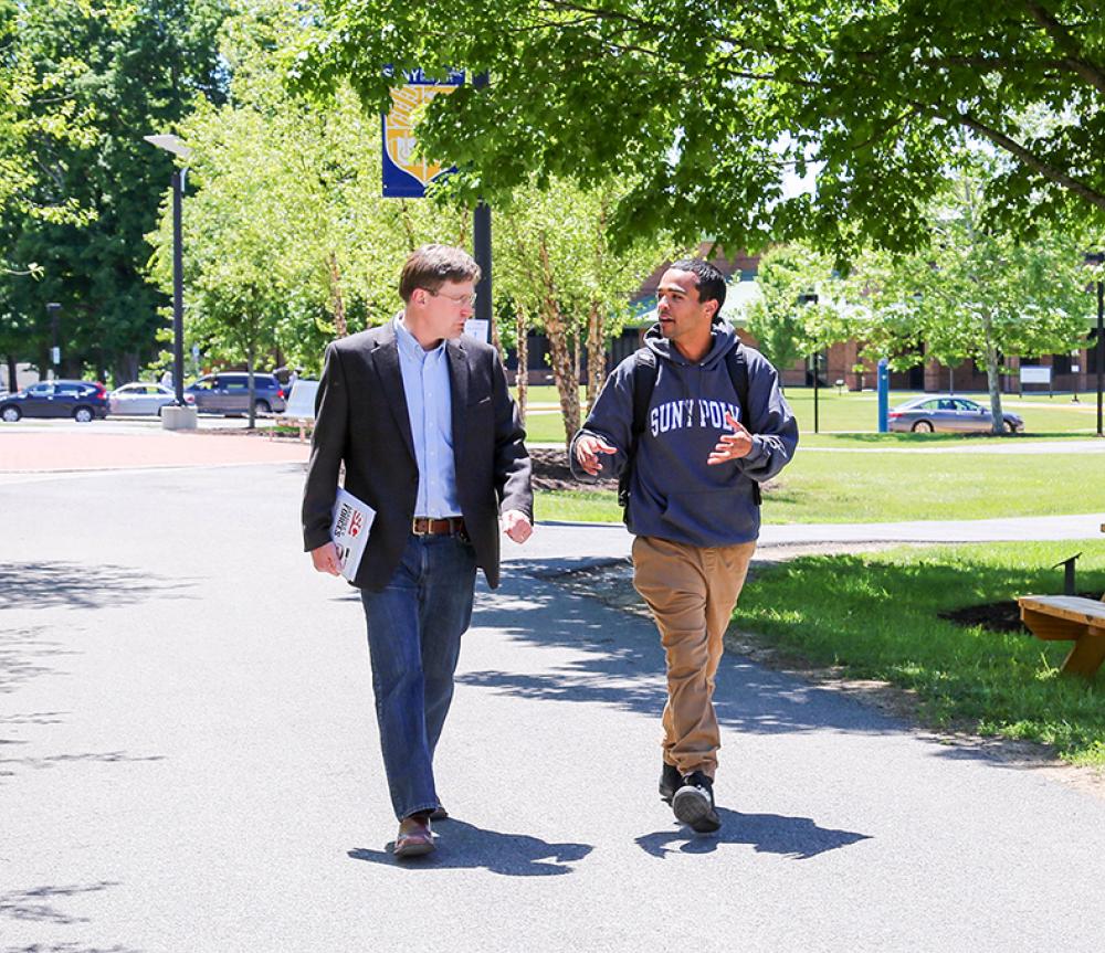 SUNY Poly professor and student walking on campus