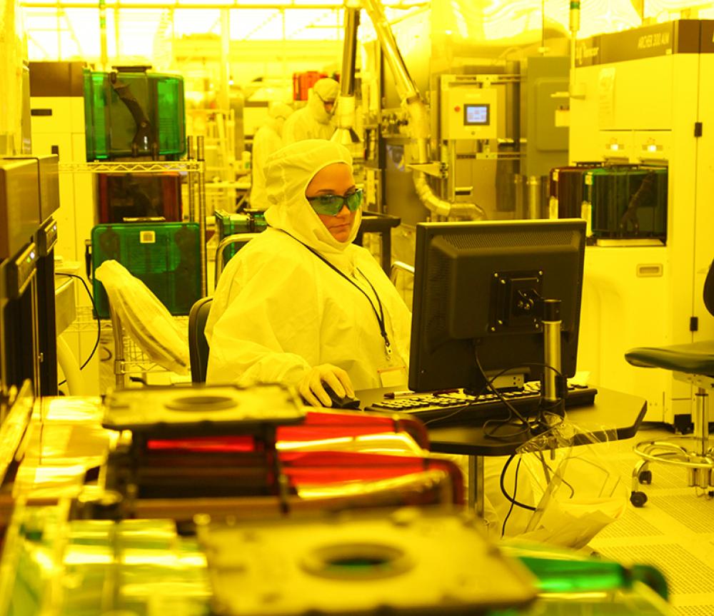 A worker in SUNY Poly's cleanroom