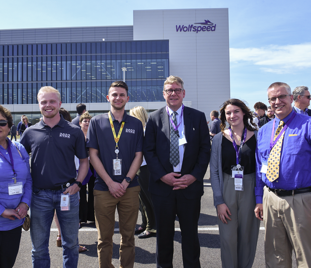 President Laursen with student and alumni at the ribbon cutting