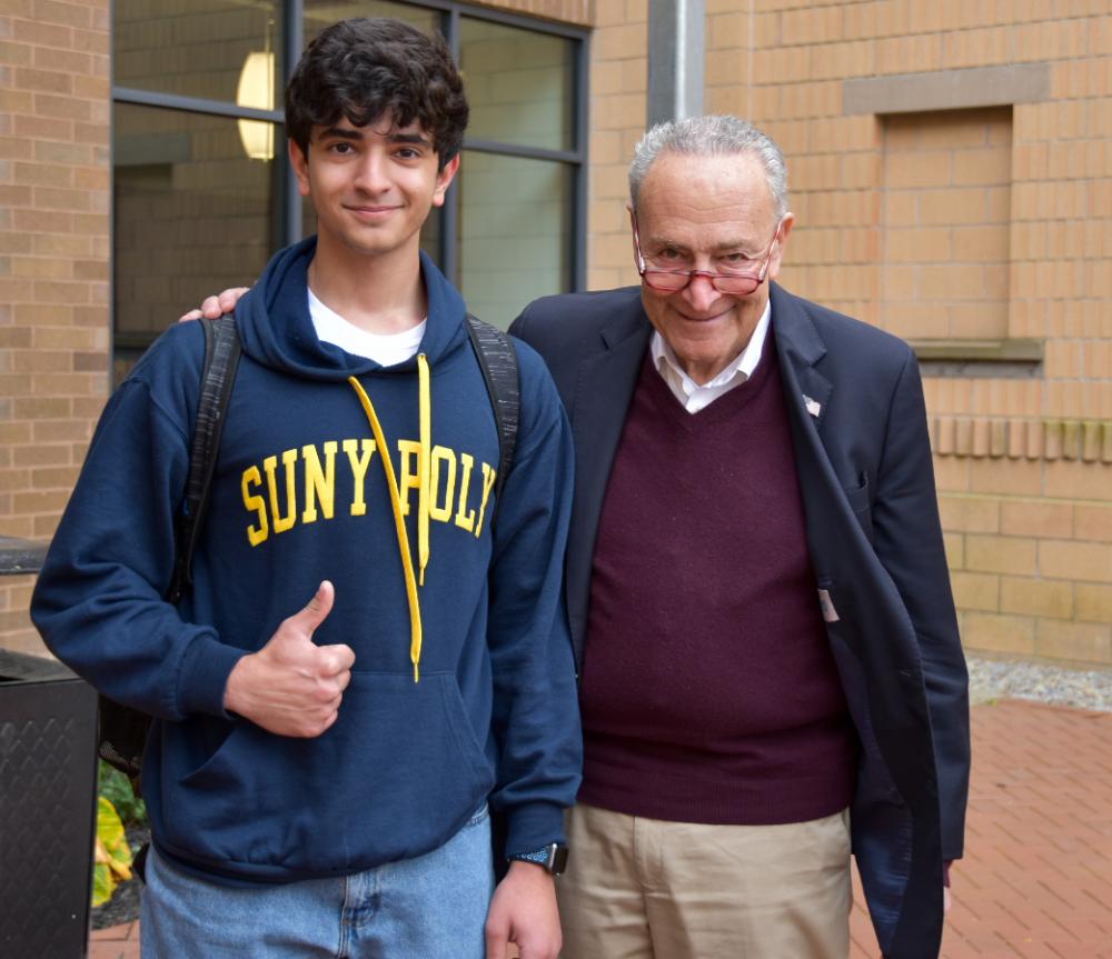 Student Joel Marji with Sen. Charles Schumer outside CGAM 