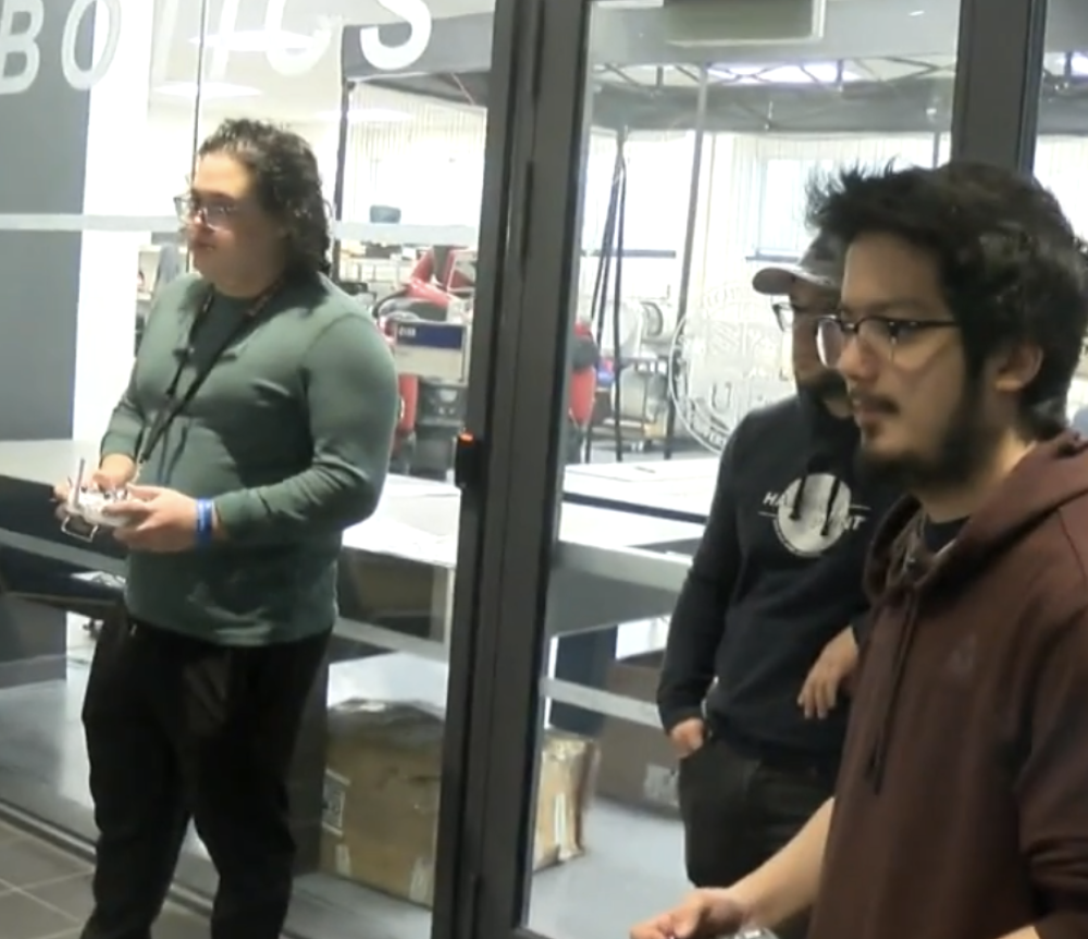 Battlebot competition image of students controlling robots