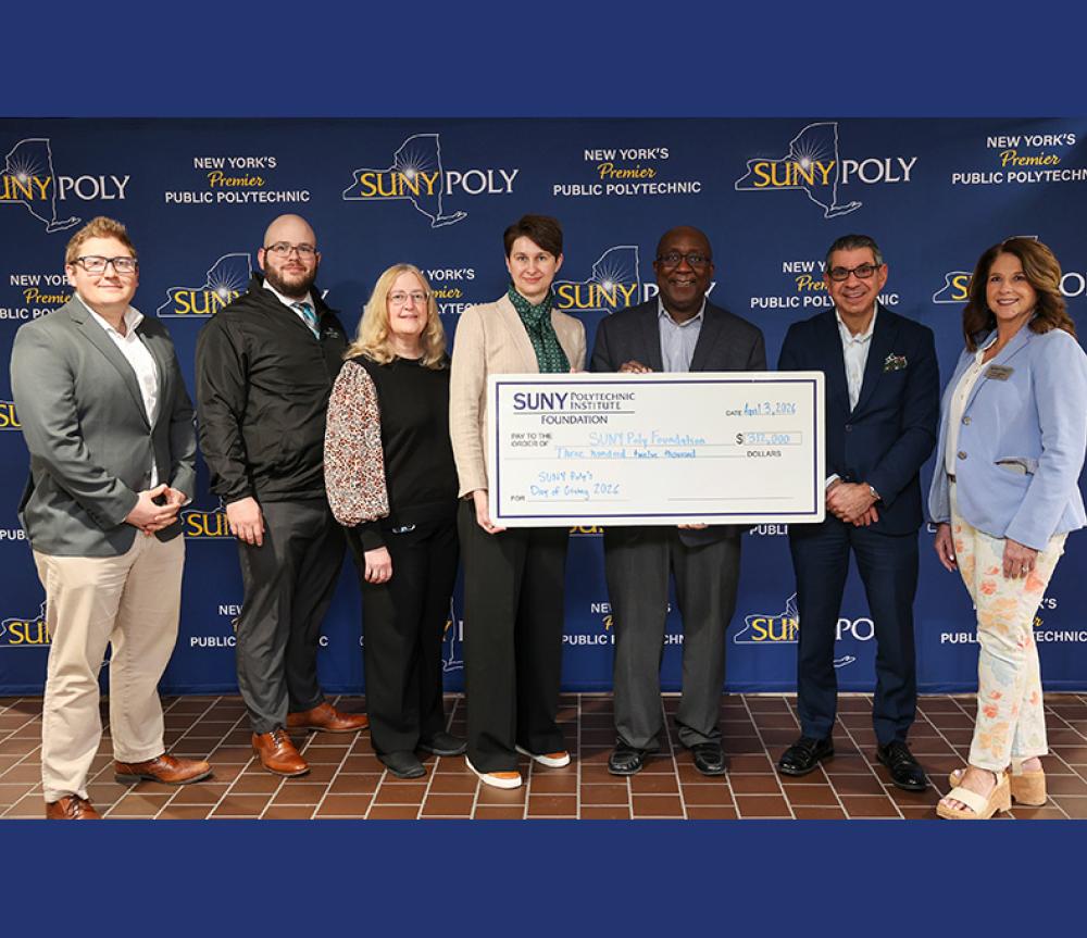 From left, SUNY Poly Associate Director of Alumni Relations Michael Aiello; Alumni Committee Member Nick Cavanaugh;, SUNY Poly VP for Finance and Administration and Foundation Treasurer Mary Ellen Burdick; Foundation Vice Chair Jasminka Husic; President Wole Soboyejo; Foundation Secretary John Hobika Jr.; and VP of Institutional Advancement and Foundation Executive Director Andrea LaGatta. 