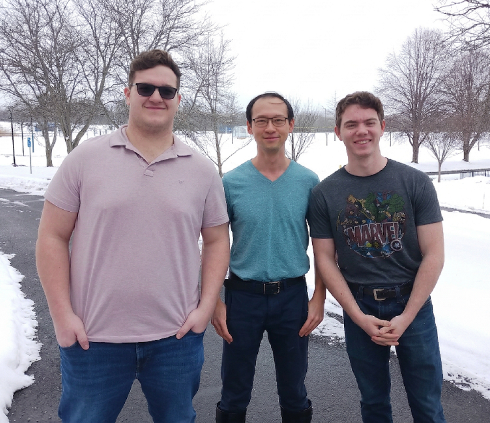 Seth, Shing Chi and Henry outside in the snow.