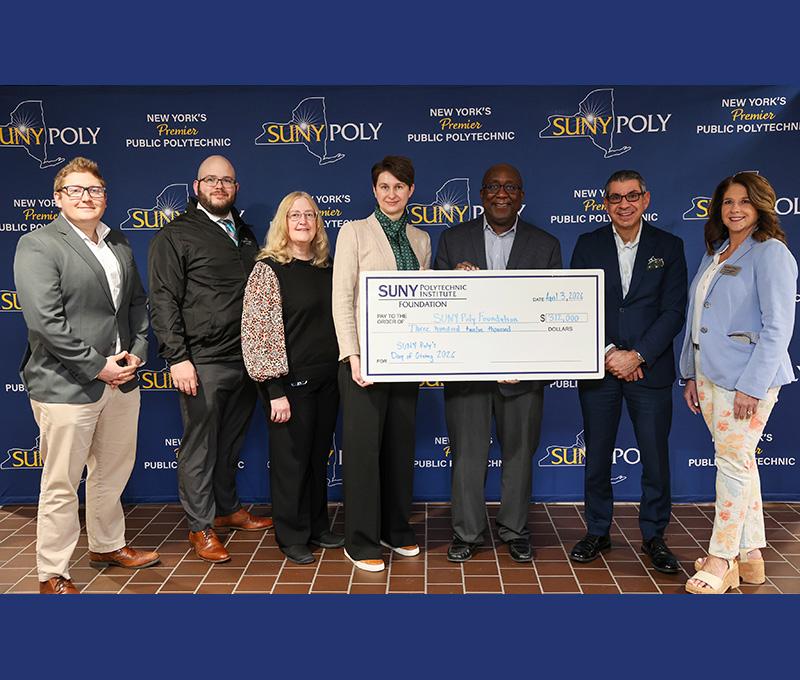From left, SUNY Poly Associate Director of Alumni Relations Michael Aiello; Alumni Committee Member Nick Cavanaugh;, SUNY Poly VP for Finance and Administration and Foundation Treasurer Mary Ellen Burdick; Foundation Vice Chair Jasminka Husic; President Wole Soboyejo; Foundation Secretary John Hobika Jr.; and VP of Institutional Advancement and Foundation Executive Director Andrea LaGatta. 
