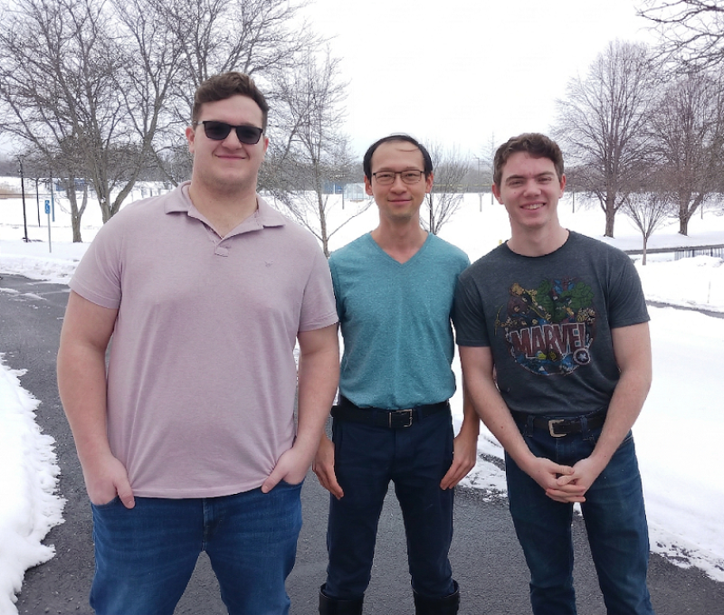 Seth, Shing Chi and Henry outside in the snow.