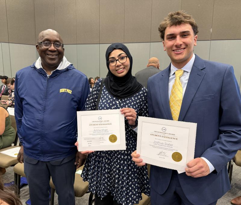 Wole with Amna and Joshua holding up their awards