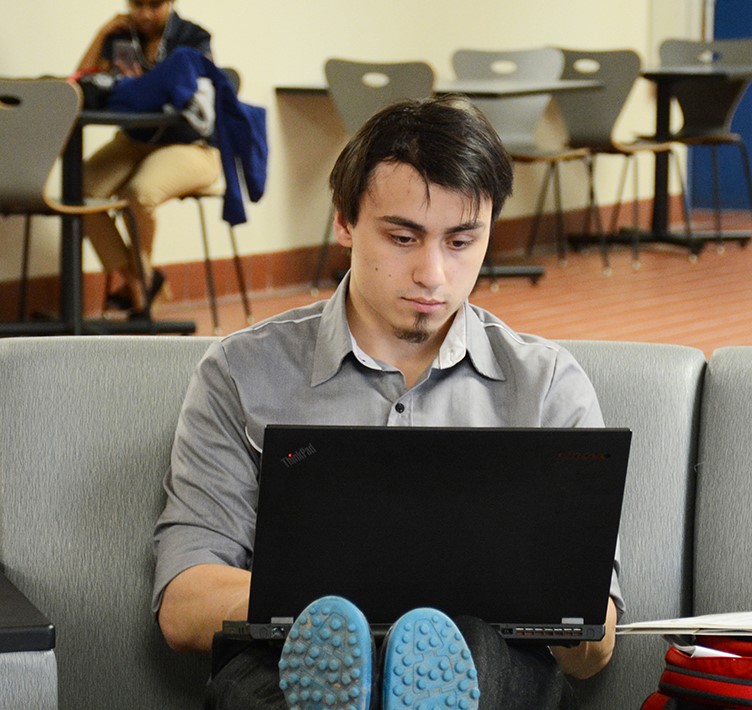 student on his laptop